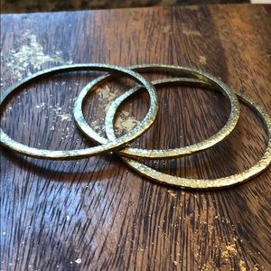 Set of three stacking hammered brass bangles